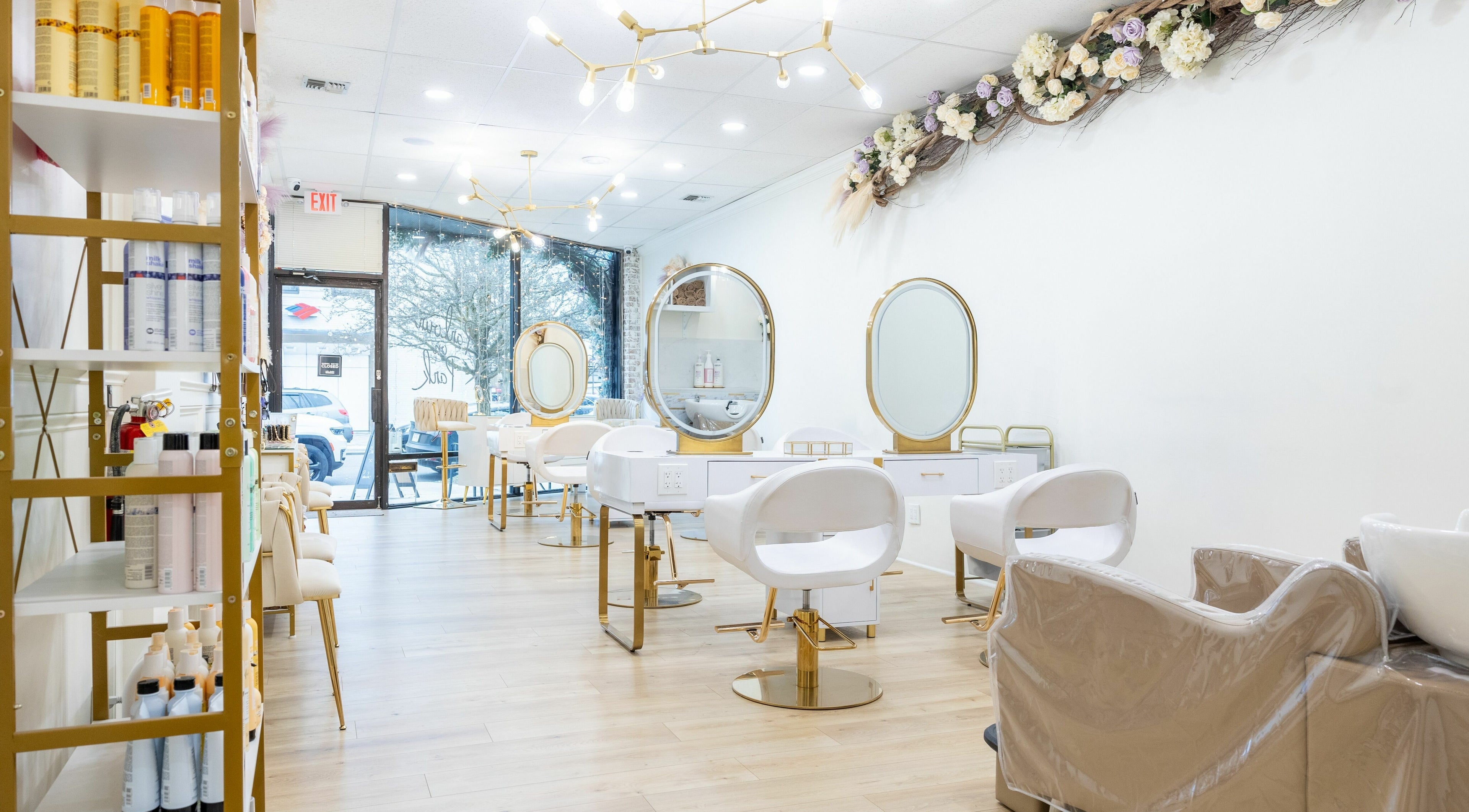 Elegant interior of Parlour On Park in Wantagh, New York, US with stylish beauty stations and decor.
