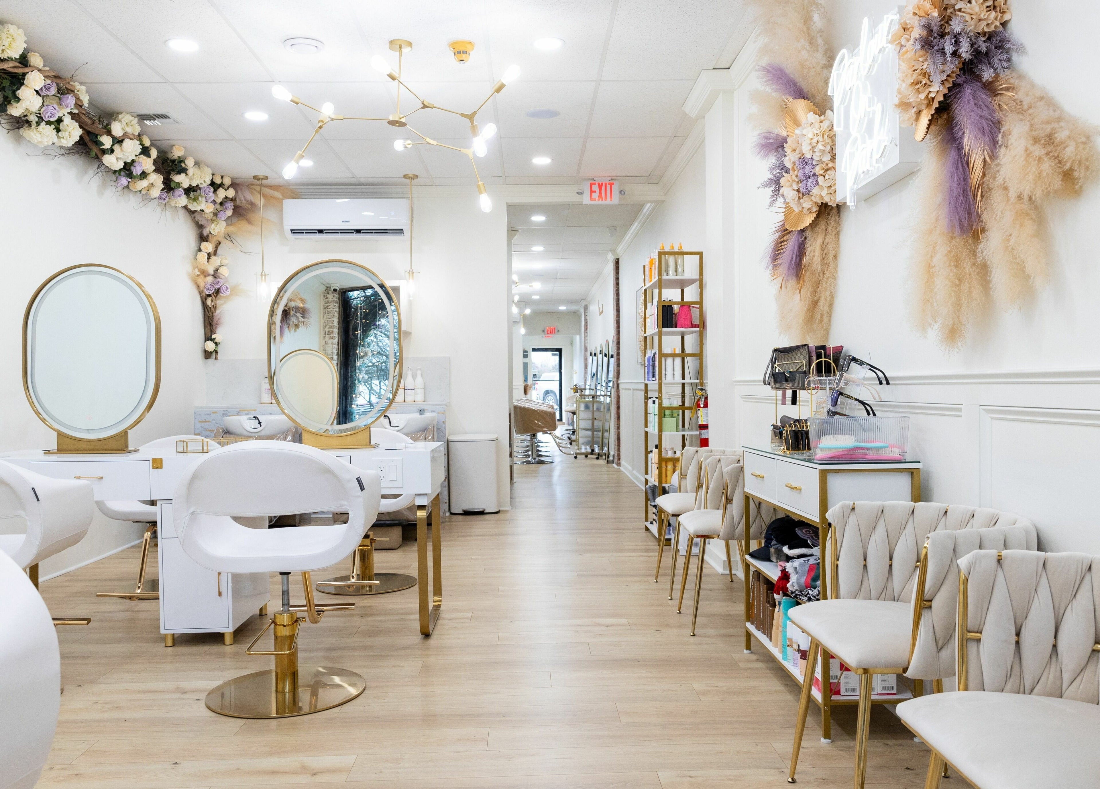 Stylish interior of Parlour On Park, Wantagh, New York, with chic mirrors and chairs.