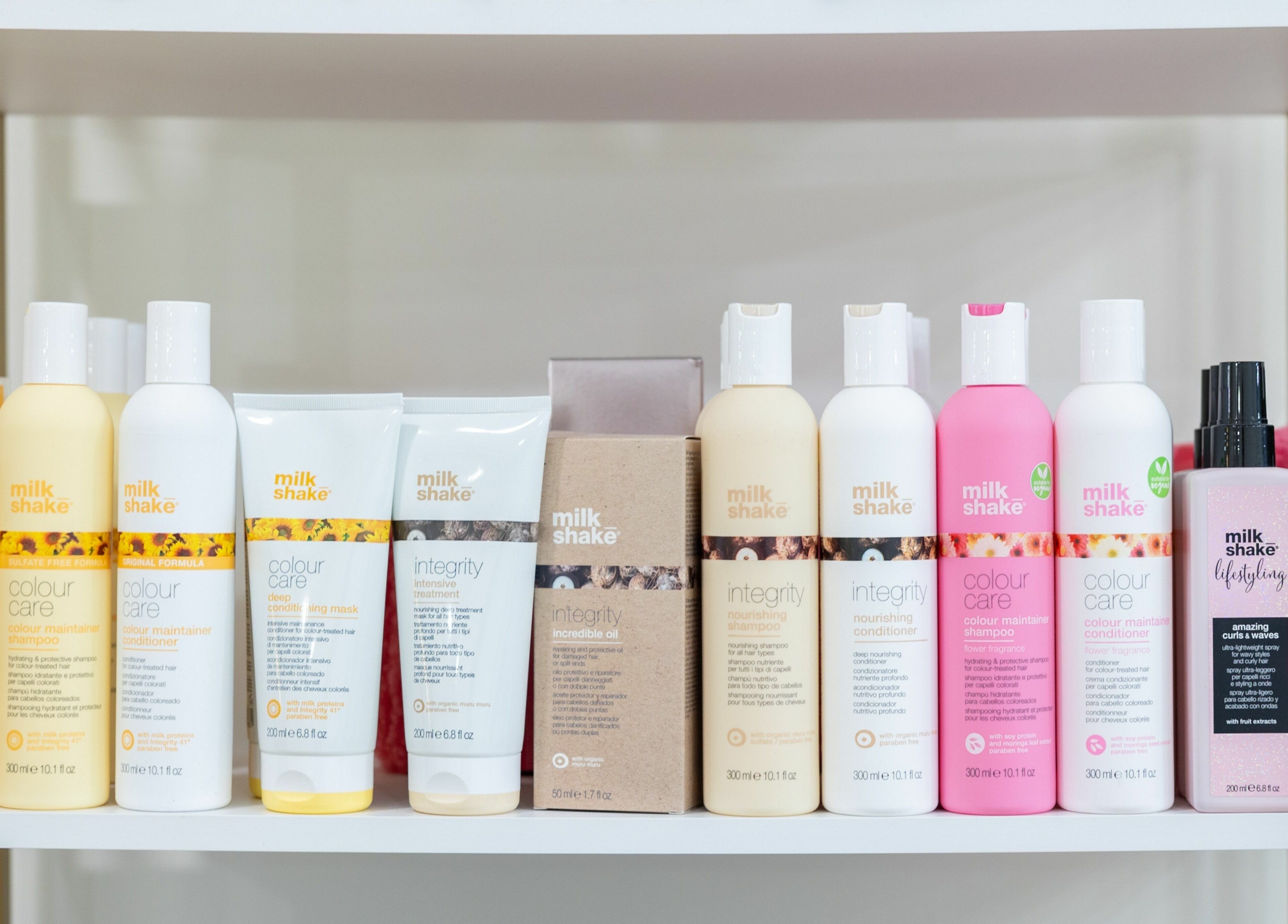 Parlour On Park in Wantagh, New York displays vibrant hair care products neatly on a salon shelf.