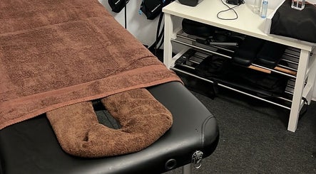 Cozy massage table at Massage to go by Thea, Attard, MT offers a serene ambiance for a relaxing experience.