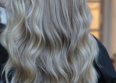 Flowing golden blonde hair styled at Blondie in Durham, North Carolina, US.