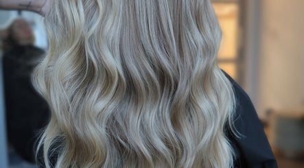 Flowing golden blonde hair styled at Blondie in Durham, North Carolina, US.
