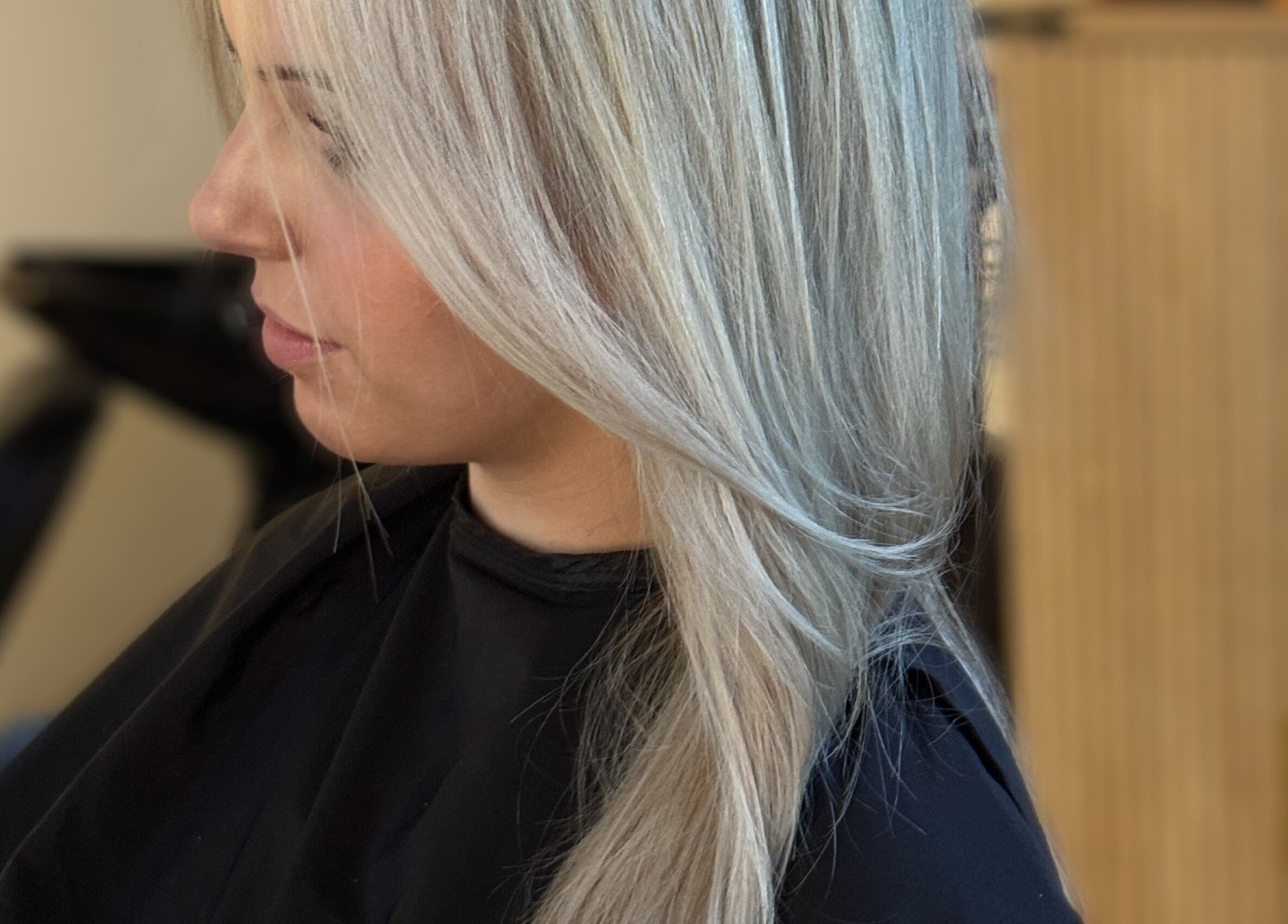 Profile of stylish blonde hairstyle at Blondie salon, Durham, North Carolina, US.