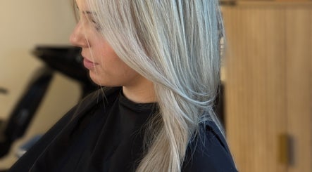 Profile of stylish blonde hairstyle at Blondie salon, Durham, North Carolina, US.