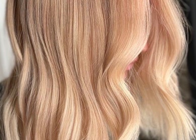 Elegant blonde hair waves at Blondie salon, Durham, North Carolina, US, showcasing expert styling.