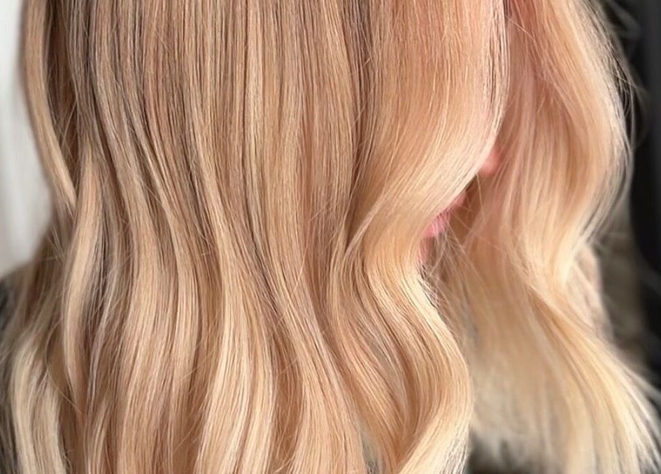 Elegant blonde hair waves at Blondie salon, Durham, North Carolina, US, showcasing expert styling.