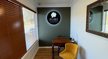 Cozy interior of Pure Massage - Martinborough in Wellington, NZ, featuring a welcoming seating area and elegant decor.