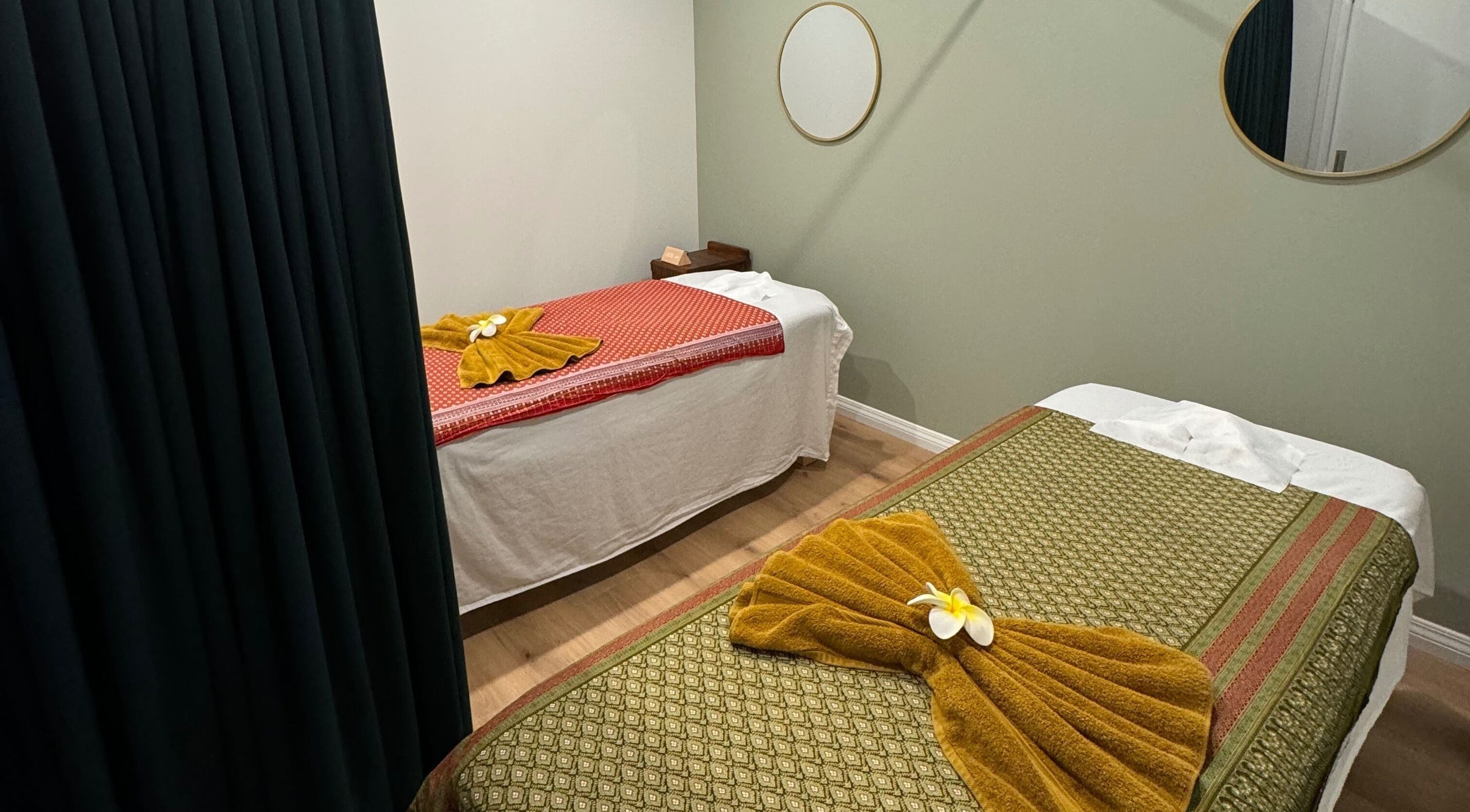 Relaxing massage room at Pure Massage - Martinborough, Wellington, NZ with two neatly adorned beds.