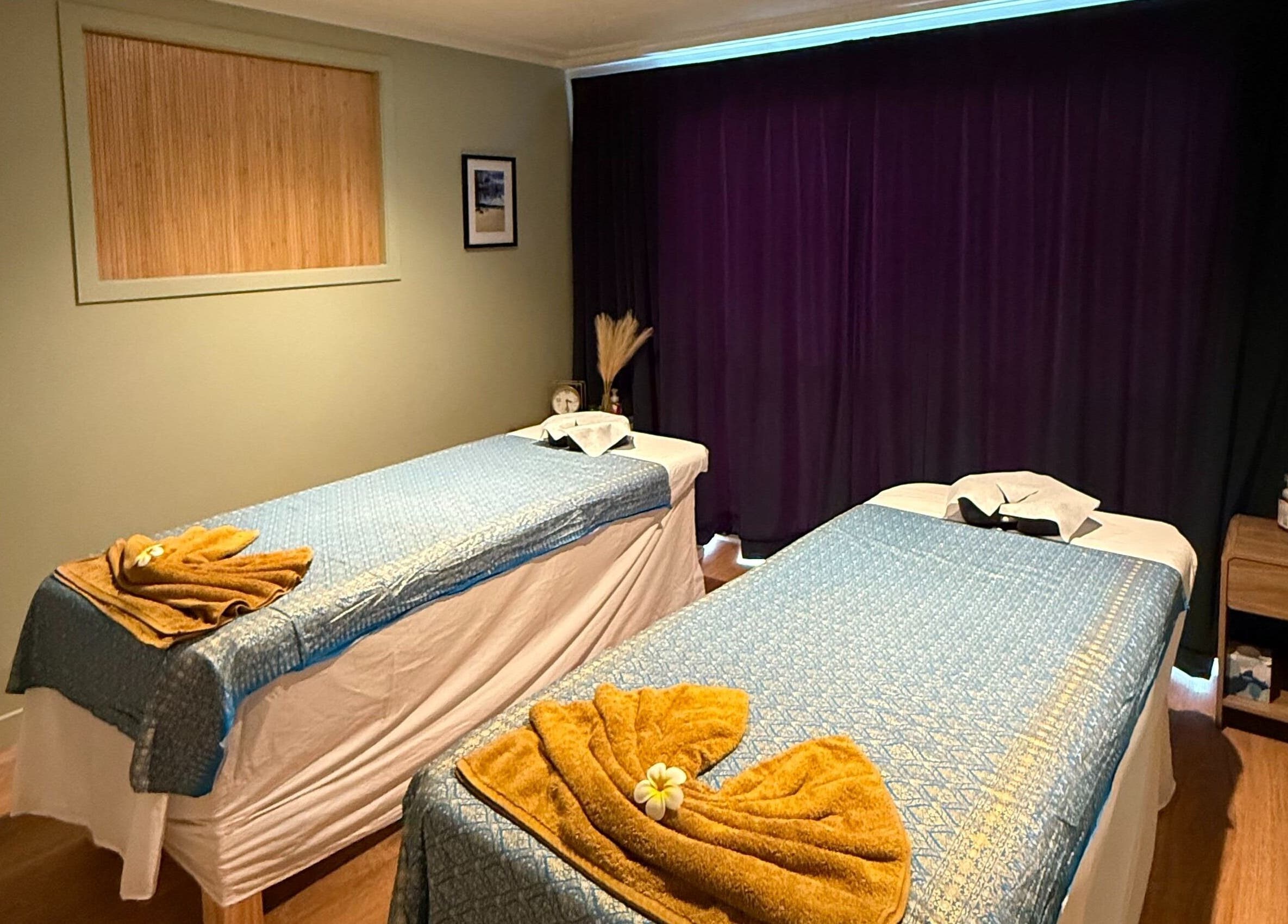 Relaxing massage room at Pure Massage - Greytown, Greytown, Wellington Region, NZ with two beds and calming decor.