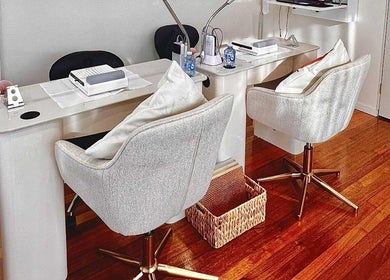 Chic nail studio setup at Studio Nail and Lashes, Melbourne, Victoria, AU with plush chairs and modern decor.