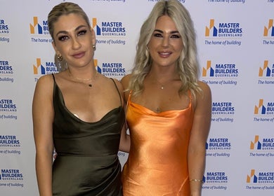 Stylish guests at TC Spray Tans event in Nerang, Queensland, AU wearing elegant dresses.