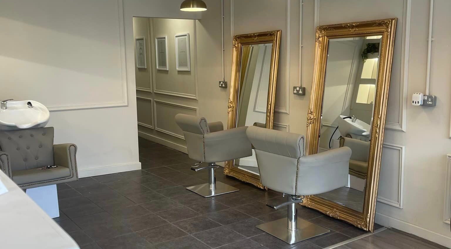 Elegant mirrors and chairs at Orchid Cove Hair and Beauty Salon in Ormskirk, England, GB.