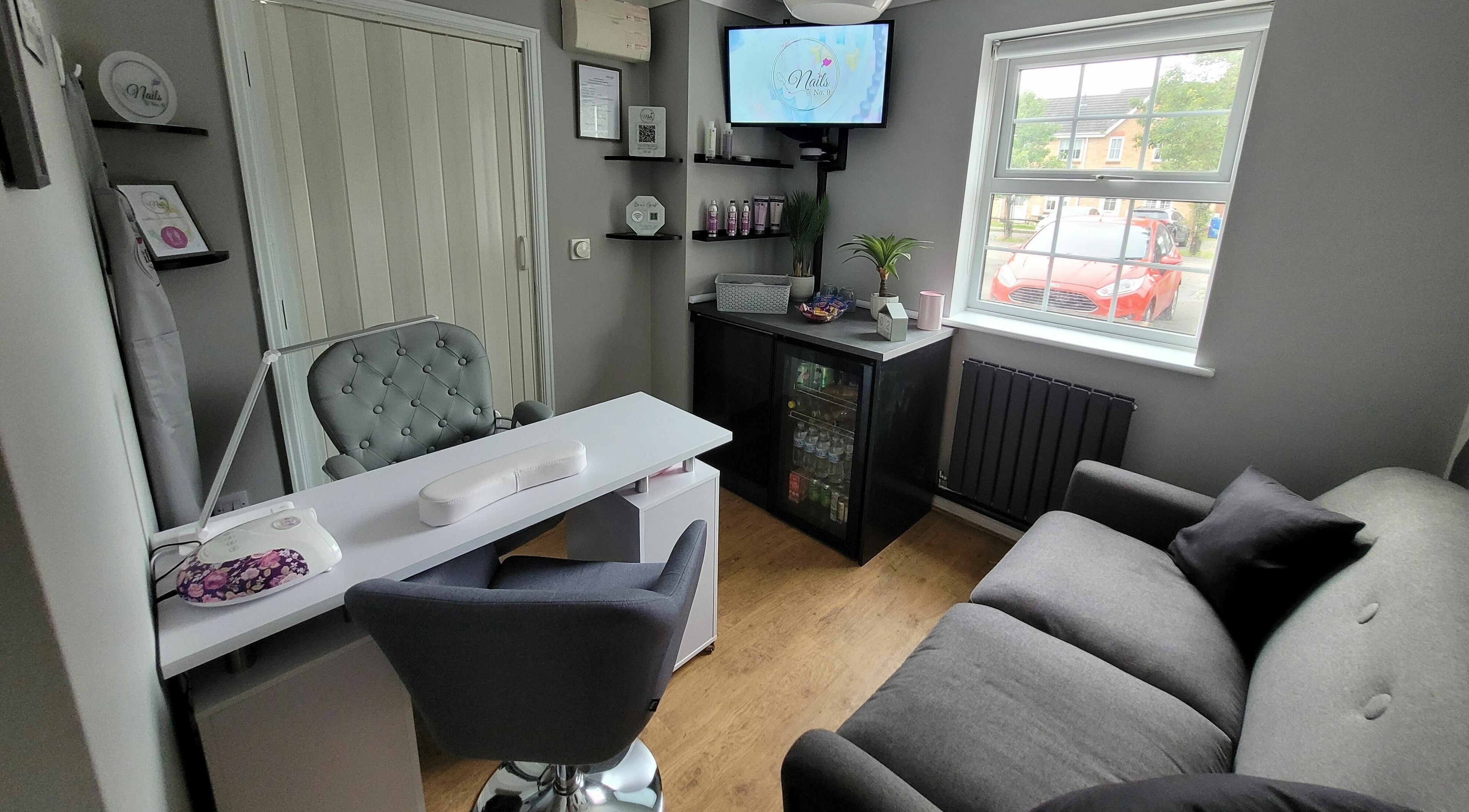 Elegant nail salon interior at Nails at No. 9, Brough, England, GB with a stylish nail desk and plush seating.