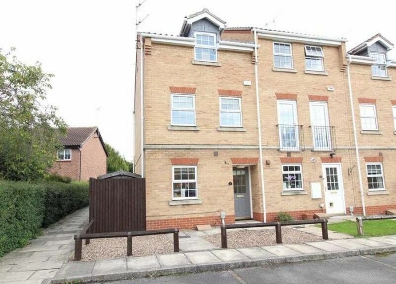 Charming brick building housing Nails at No. 9, located in Brough, England, GB, offering beauty and wellness services.
