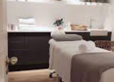 Relaxing treatment room at Brow Expert Beauty in Dublin, County Dublin, IE with a massage bed and soft lighting.