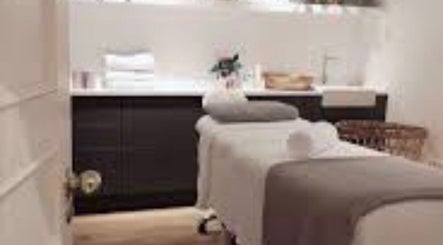 Relaxing treatment room at Brow Expert Beauty in Dublin, County Dublin, IE with a massage bed and soft lighting.