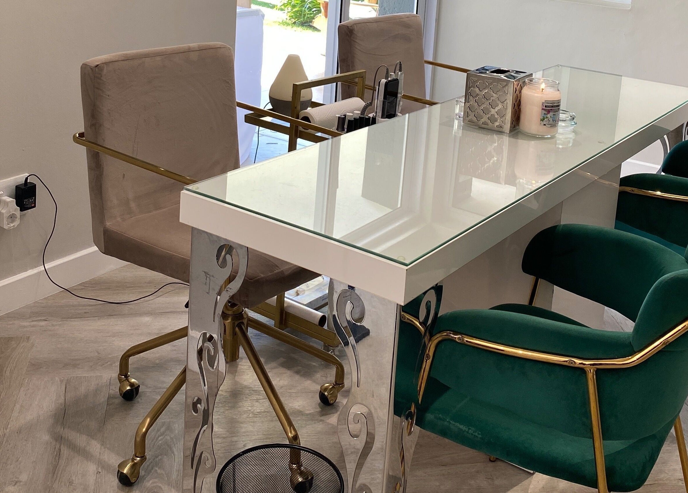 Elegant nail salon table at DASH in Johannesburg, Gauteng, ZA with plush chairs and chic decor.