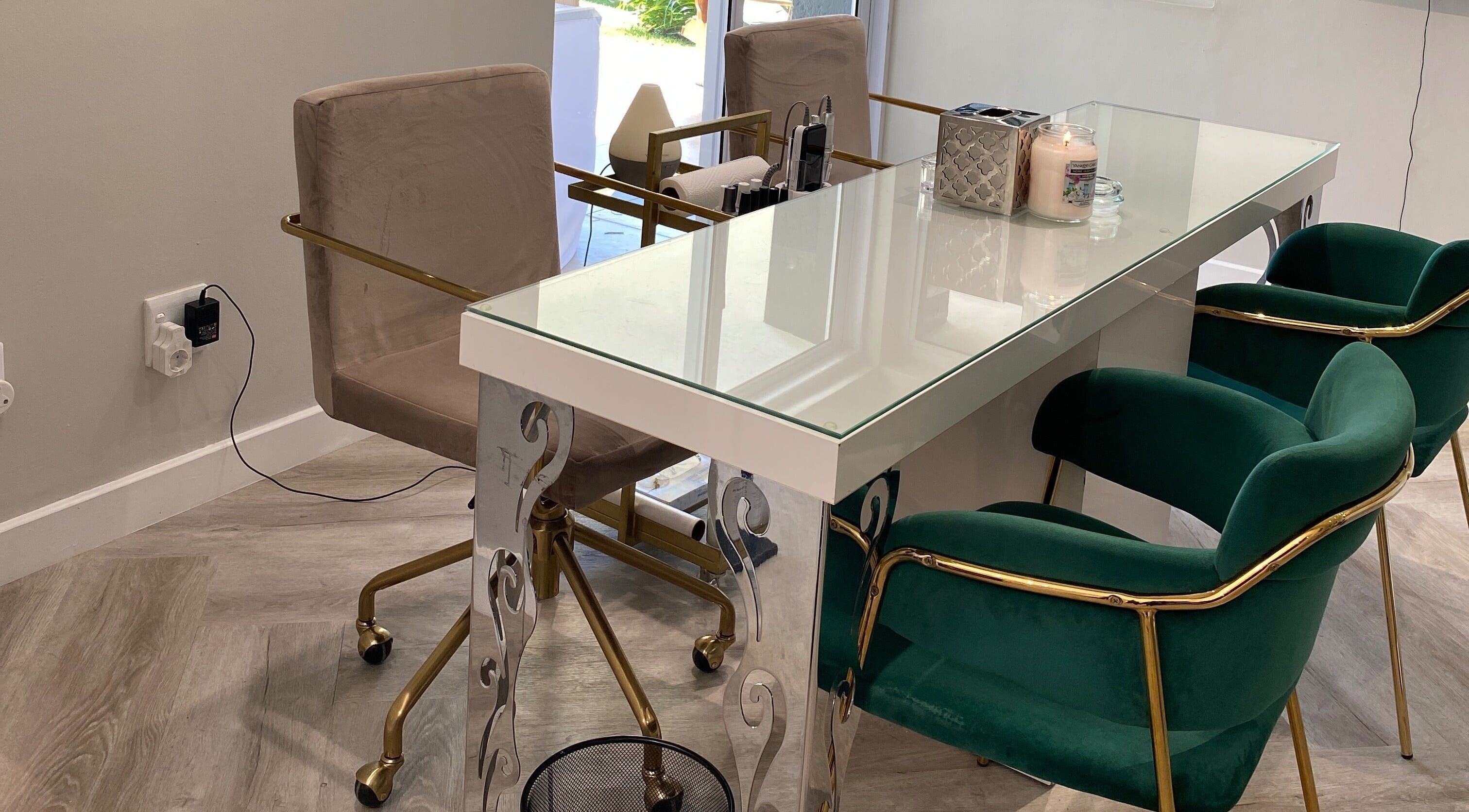 Elegant nail salon table at DASH in Johannesburg, Gauteng, ZA with plush chairs and chic decor.