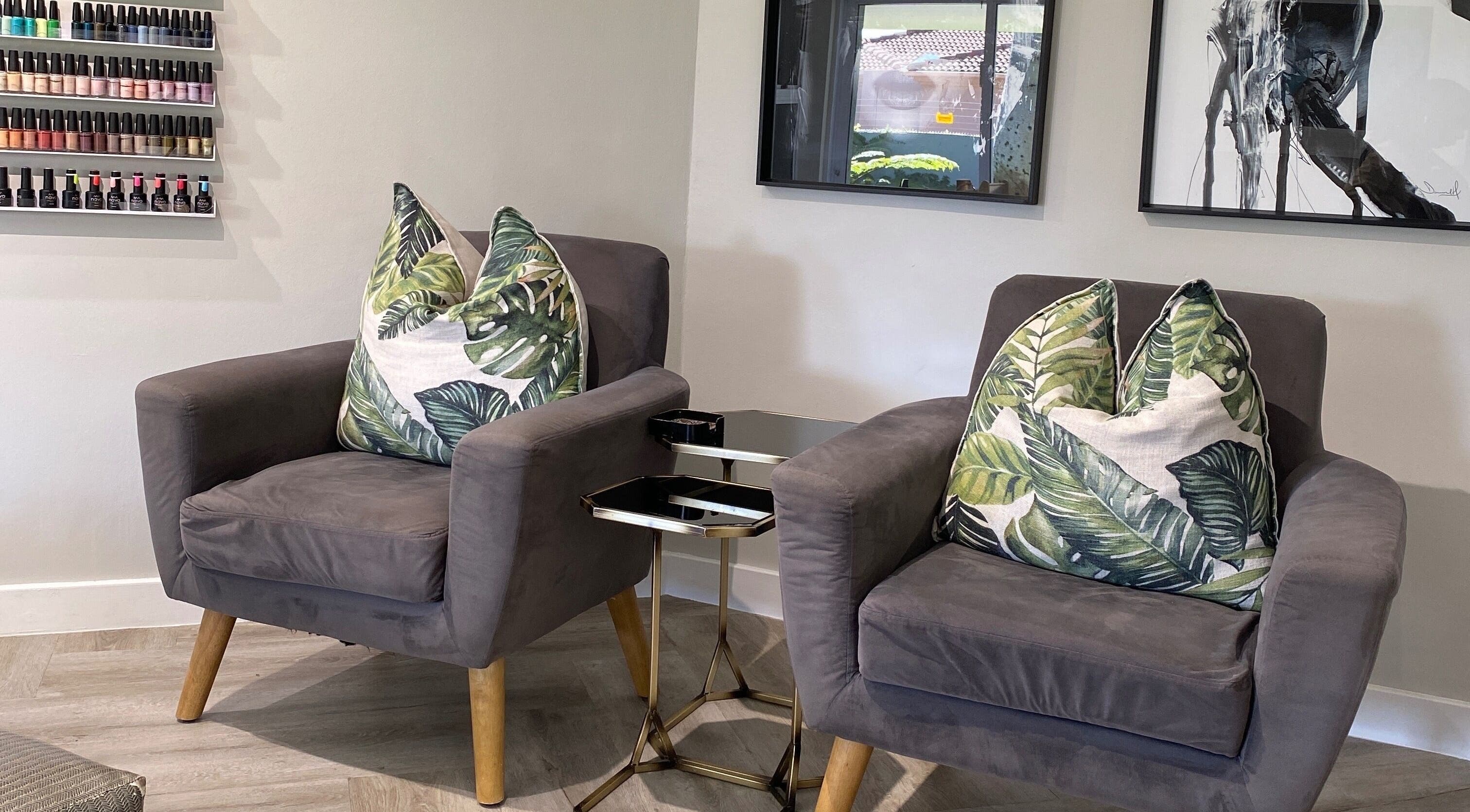 Comfortable seating area with stylish pillows at DASH, Johannesburg, Gauteng, ZA.