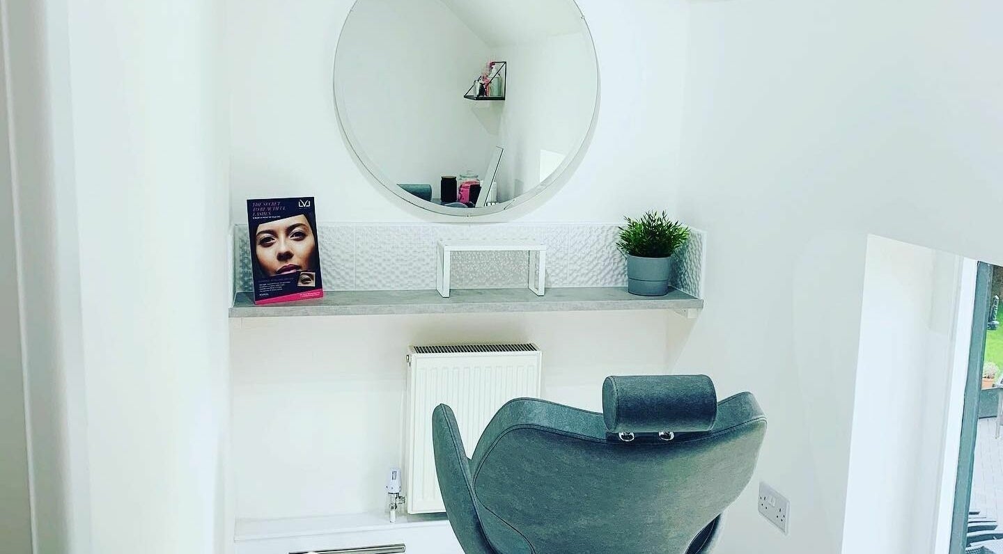 Modern beauty station with a mirror and stylish chair at SJP Beauty, Tutbury, England, GB.