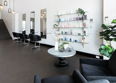 Elegant interior of Vescada Hair and Beauty in Bella Vista, New South Wales, AU with modern decor and styling chairs.
