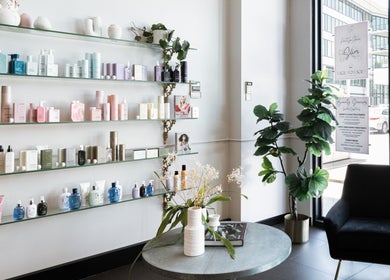Stylish interior of Vescada Hair and Beauty in Bella Vista, New South Wales, AU, featuring a product display.