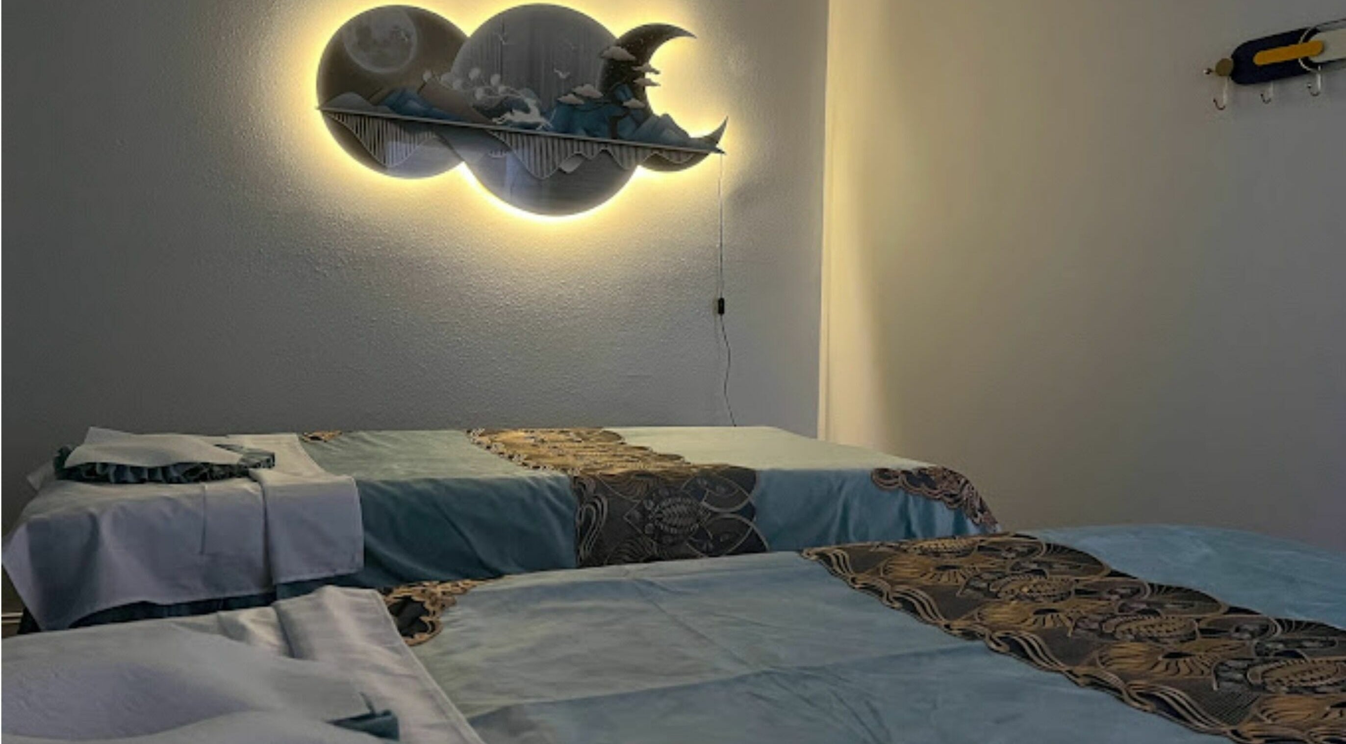 Relaxing massage room at LY Massage and Beauty, Sarasota, Florida, US with soothing decor and ambient lighting.