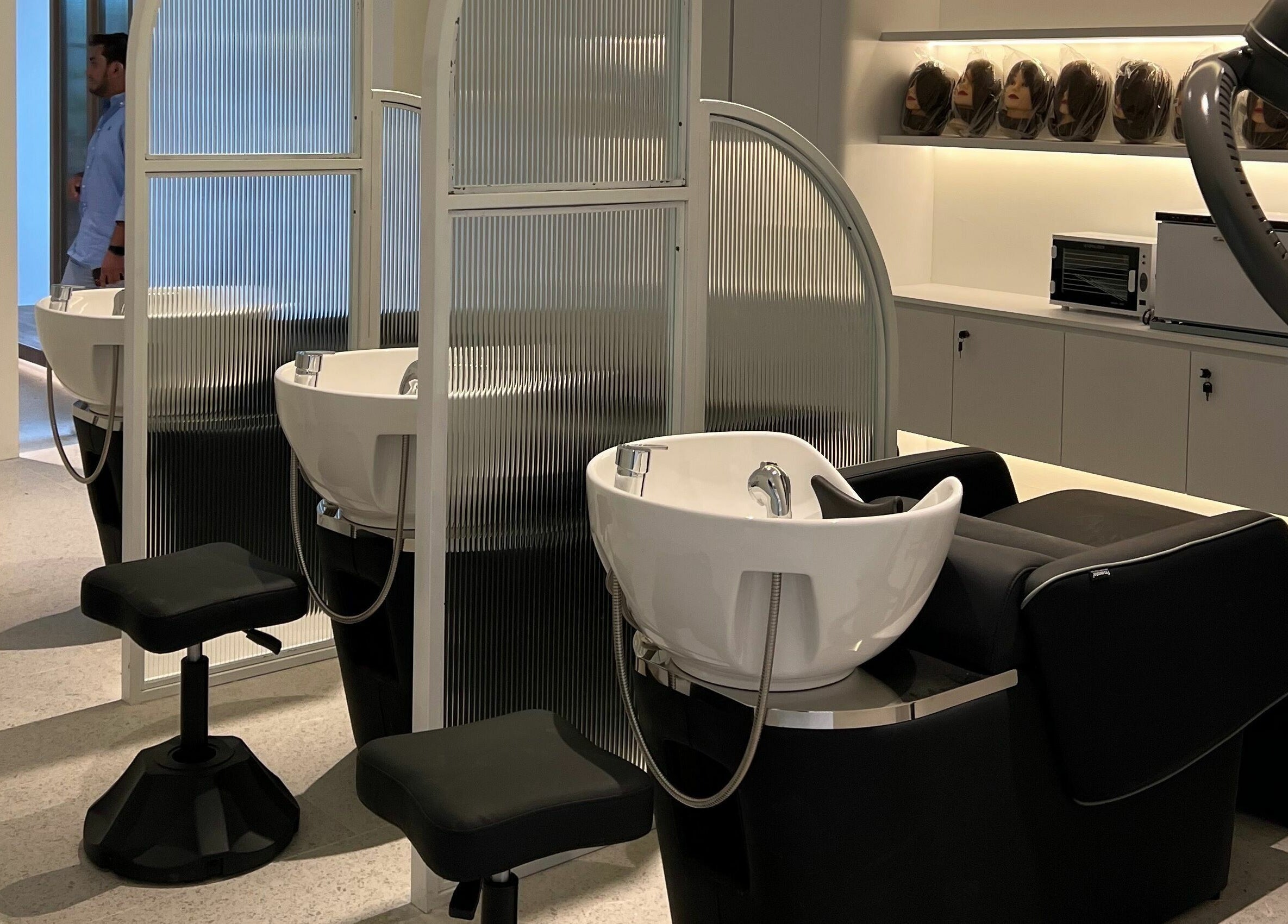 Modern salon washing stations at Hair Library in Petaling Jaya, Selangor, MY, featuring sleek design for a luxury experience.