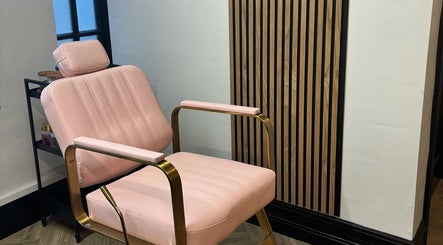Elegant pink beauty chair at The Glam Bar, Midleton, County Cork, IE. A blend of comfort and style in a serene setting.