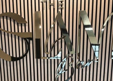 Glamorous signage at The Glam Bar, Midleton, County Cork, IE with reflective metallic letters.