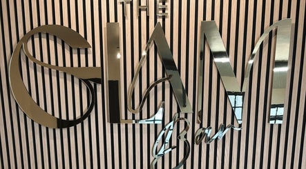 Glamorous signage at The Glam Bar, Midleton, County Cork, IE with reflective metallic letters.