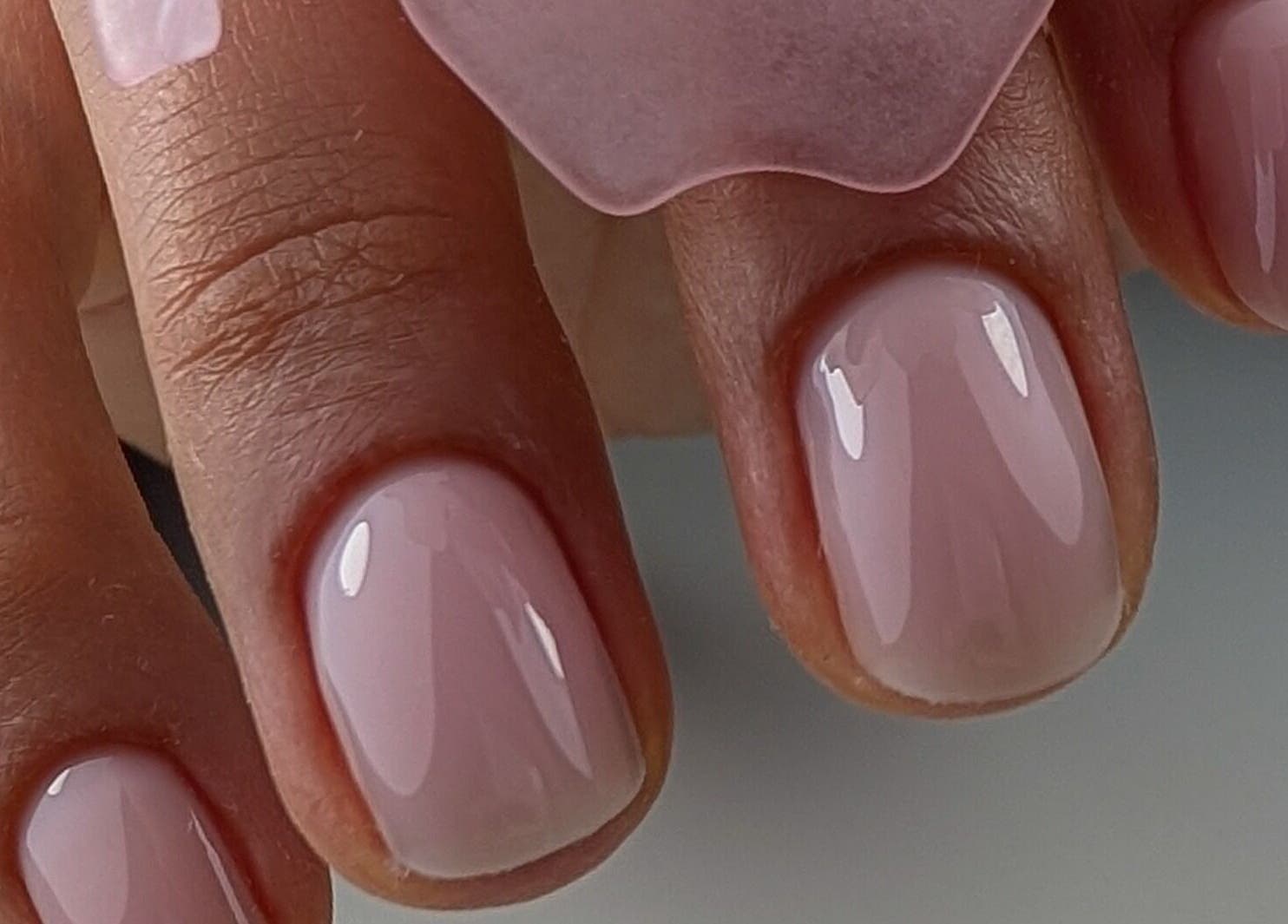Glossy polished nails at Pure&Luxe Nails, Northampton, England, GB showcasing elegant manicure.