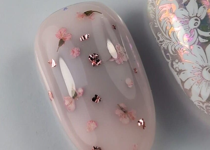 Delicate floral nail art at Pure&Luxe Nails in Northampton, England, GB. A beautiful display of craftsmanship.