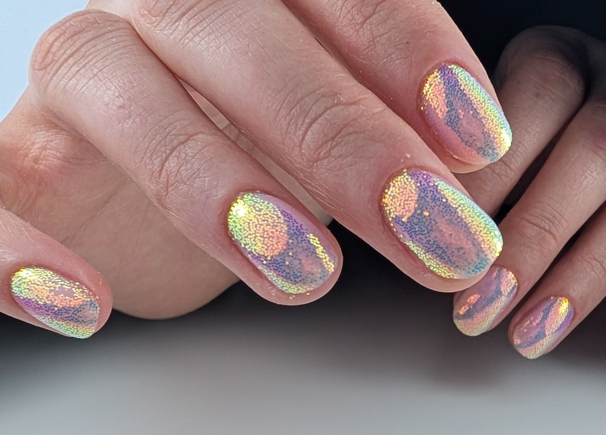 Iridescent manicure at Pure&Luxe Nails, Northampton, England, GB, showcasing delicate nail art design.