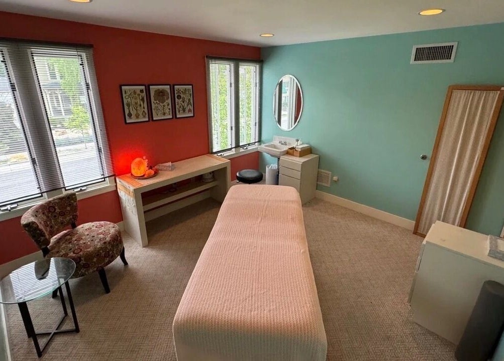 Relaxing therapy room at UPTOWN Wild Crocus Holistic Therapies in Minneapolis, Minnesota, US with cozy decor.
