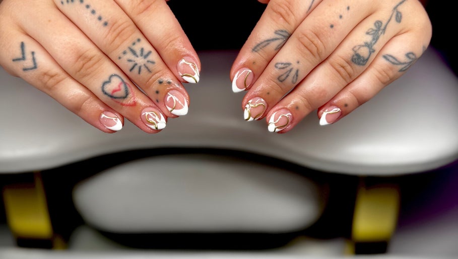 Stylish nail art design at Bree Taylorr in Weymouth, England, GB. Intricate patterns and tattoos visible.