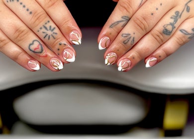 Stylish nail art design at Bree Taylorr in Weymouth, England, GB. Intricate patterns and tattoos visible.
