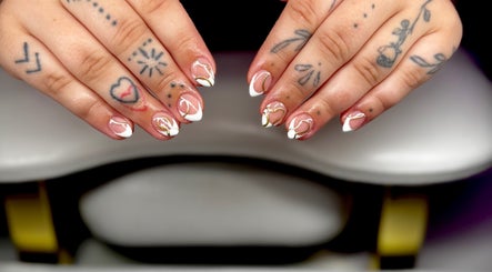 Stylish nail art design at Bree Taylorr in Weymouth, England, GB. Intricate patterns and tattoos visible.