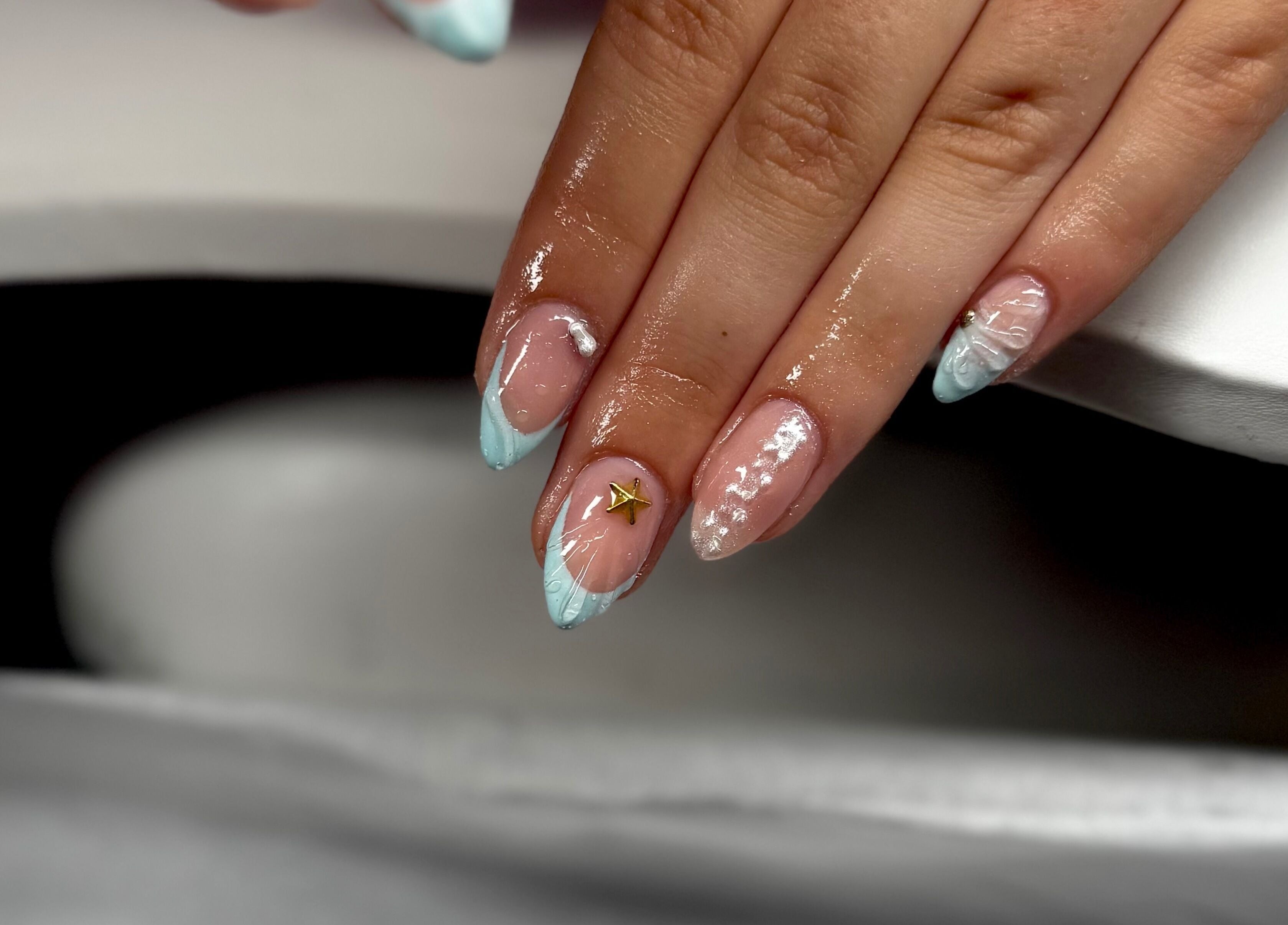 Elegant aqua nail art with gold accent at Bree Taylorr, Weymouth, England, GB.