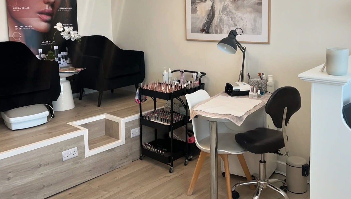 Elegant nail station at Opal Ink & Laser, Whiston, England, GB showcasing polished nail tools and seating.