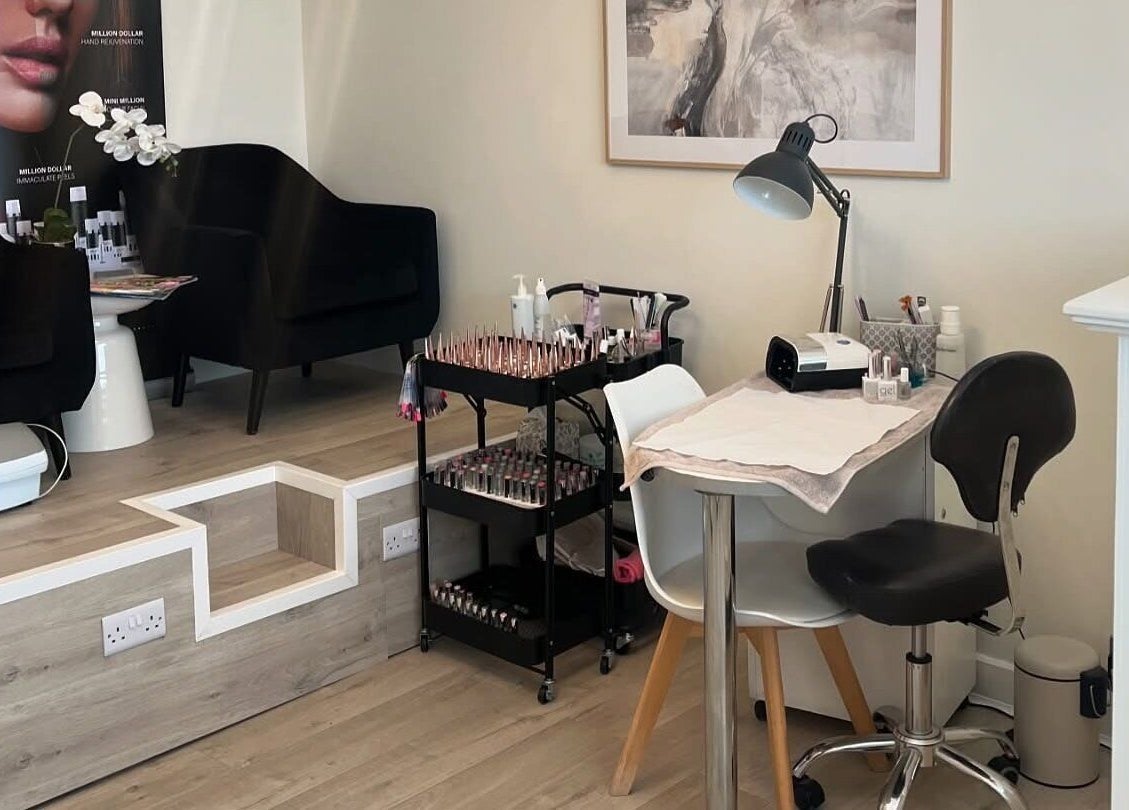 Elegant nail station at Opal Ink & Laser, Whiston, England, GB showcasing polished nail tools and seating.