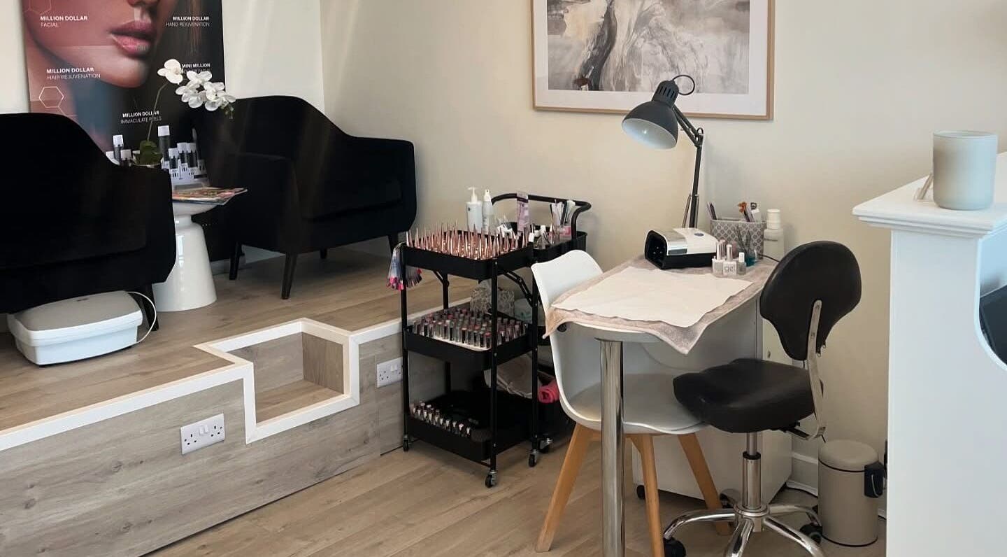 Elegant nail station at Opal Ink & Laser, Whiston, England, GB showcasing polished nail tools and seating.