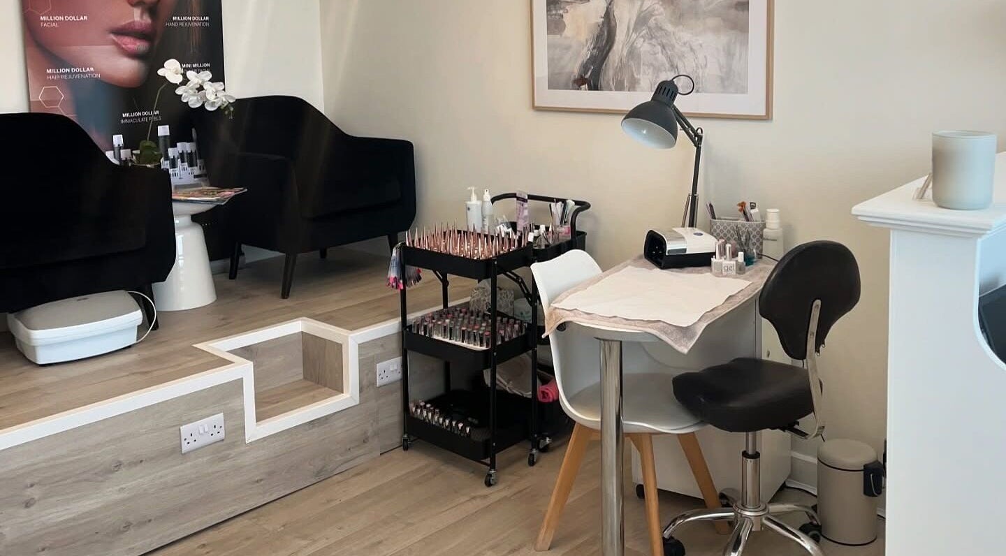 Elegant nail station at Opal Ink & Laser, Whiston, England, GB showcasing polished nail tools and seating.