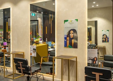 Stylish interior of Atelier Hair by C, West Ryde, New South Wales, AU showcasing chic salon chairs and mirrors.