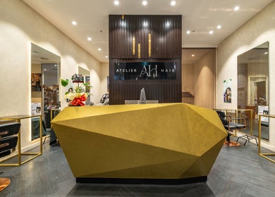 Elegant lobby of Atelier Hair by C in West Ryde, New South Wales, AU, featuring modern design and stylish chairs.