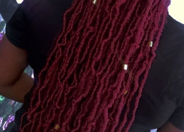 Rich Girlz Hair Studio in Houston, Texas, offers stunning dreadlocks styling for a chic look.