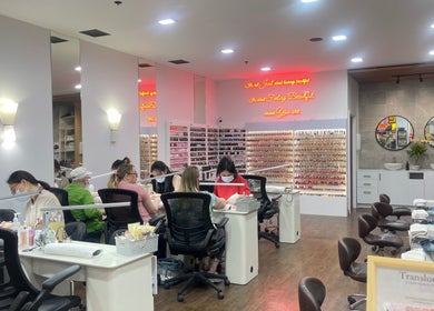 Interior of Castle Nail Bar in Edwardstown, South Australia, AU with clients and staff at work.