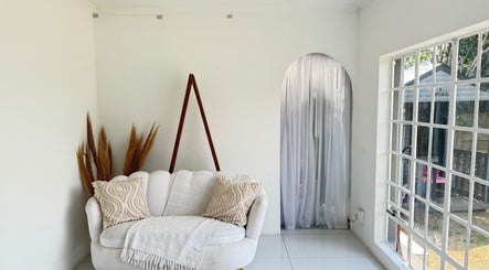 Cozy corner in Morganite Photography, Alberton, Gauteng, ZA with white sofa and natural decor.