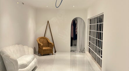 Elegant lounge with chair and sofa at Morganite Photography, Alberton, Gauteng, ZA.