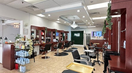 Modern interior of Act II Salon in Fairfax, Virginia, US with elegant styling stations.